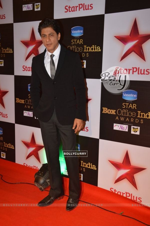 Shah Rukh Khan poses for the media at the Star Box Office Awards