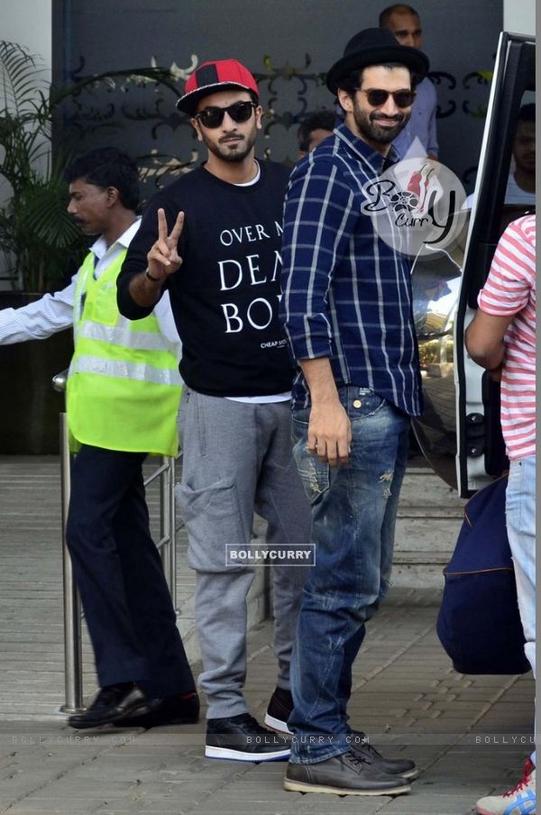 Ranbir Kapoor and Aditya Roy Kapur pose for media at Airport while leaving for ISL Football match