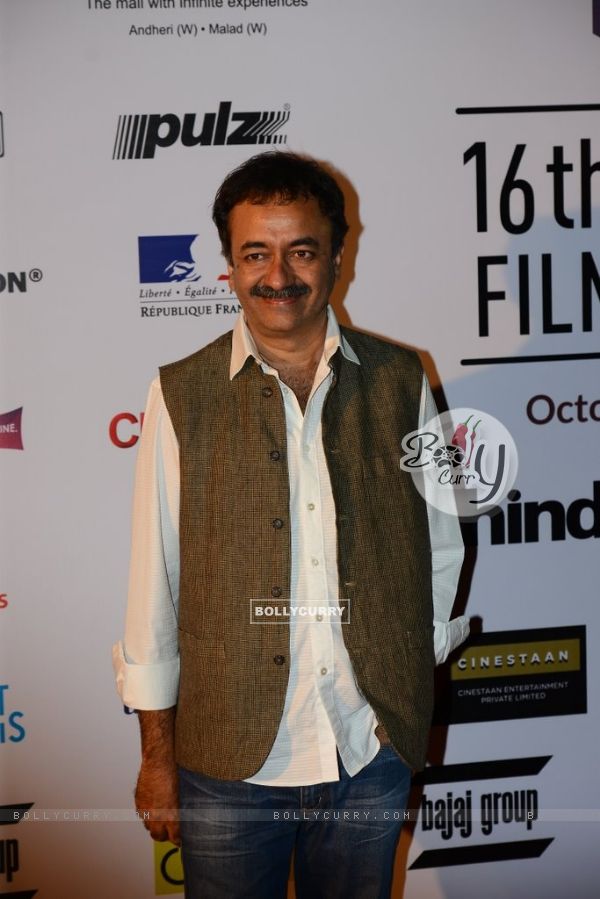 Rajkumar Hirani poses for the media at the 16th MAMI Film Festival