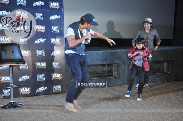 Hrithik Roshan shakes a leg with a young fan at the Special Screening of Bang Bang