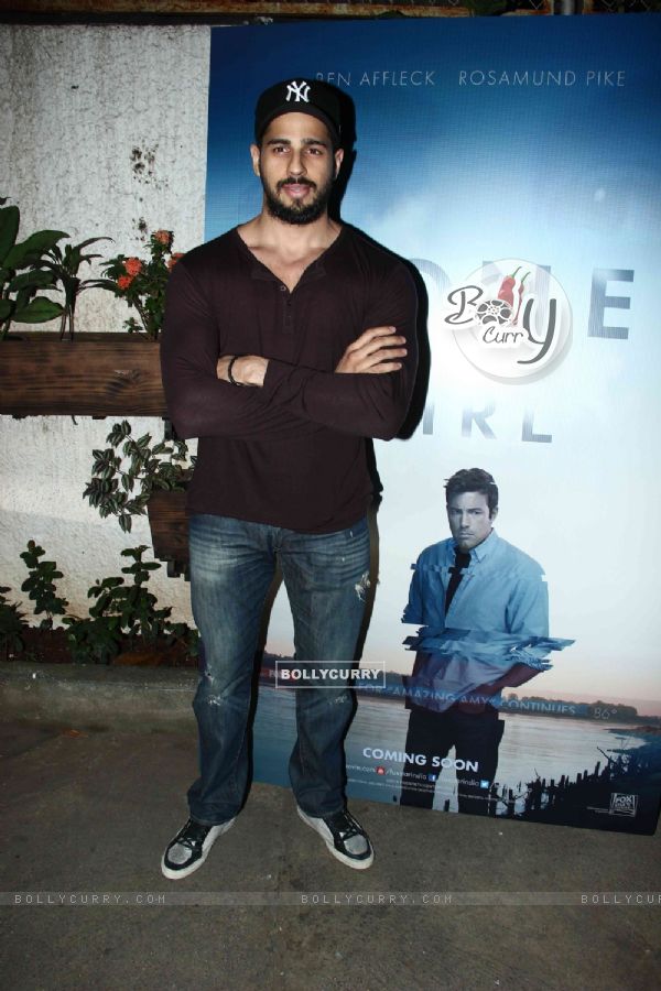 Sidharth Malhotra poses for the media at the Special Screening of Ben Affleck's Gone Girl
