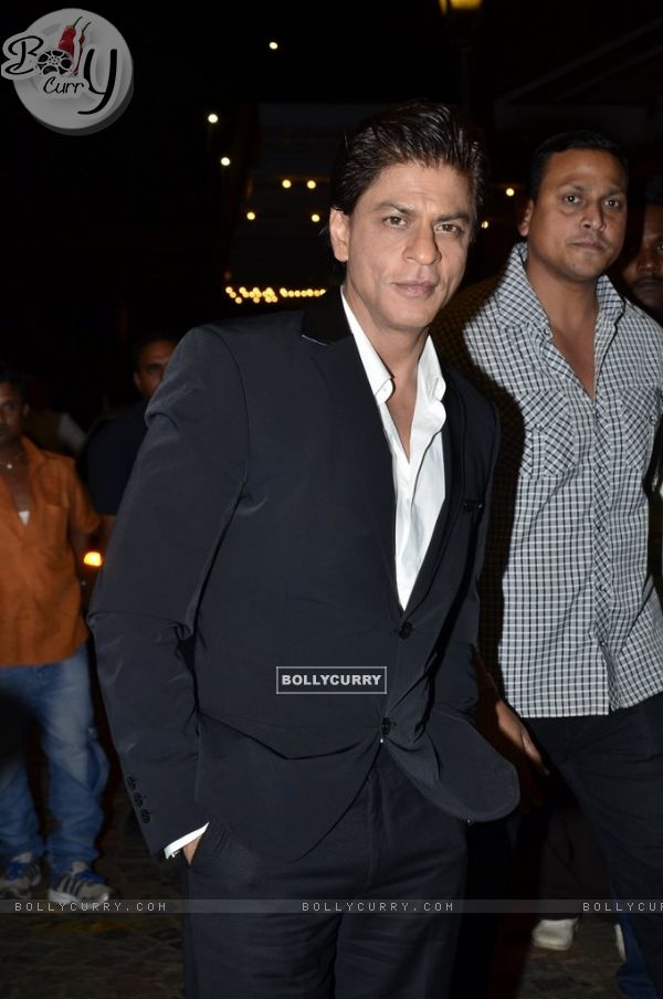 Shah Rukh Khan poses for the media at SBS Party