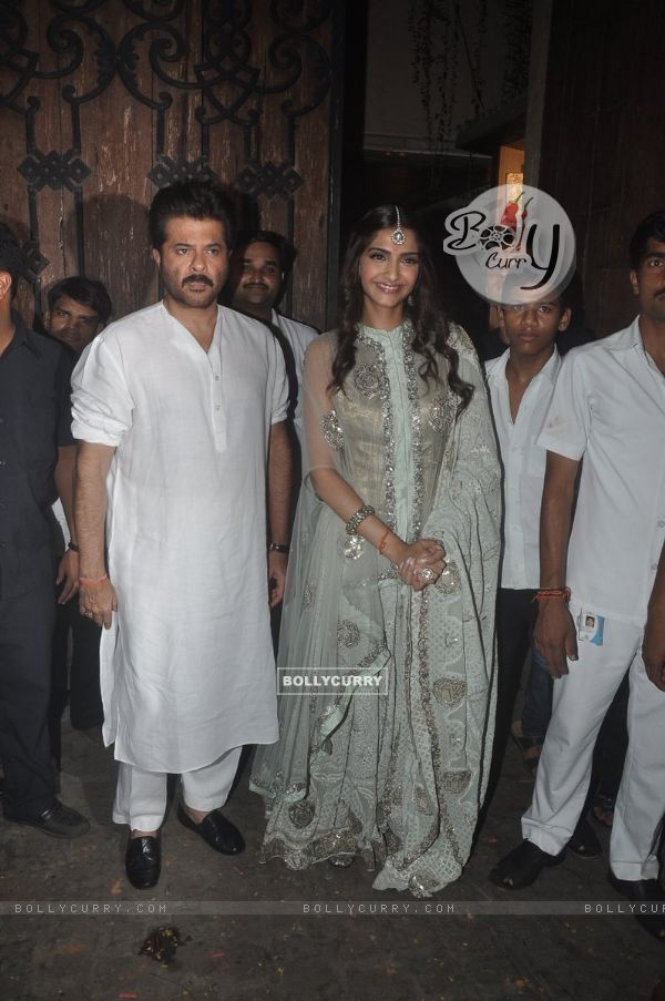 Anil Kapoor and Sonam Kapoor pose for the media during Diwali Celebration