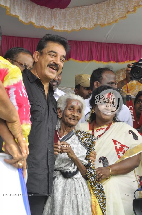 Kamal Haasan poses with a fan at the Launch of Lake Cleaning Movement