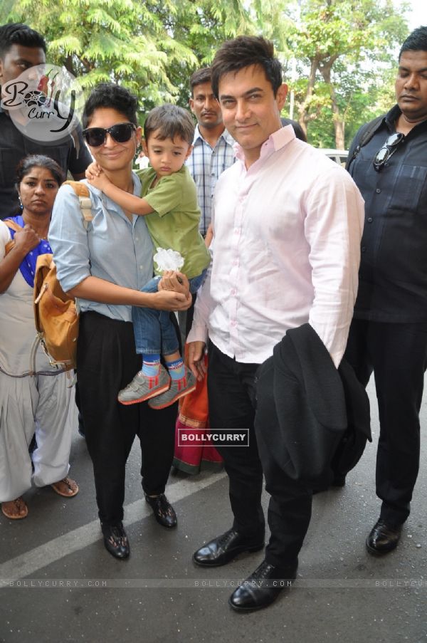 Aamir Khan and Kiran Rao along their son Azad at airport while leaving for Arpita Khan's Wedding