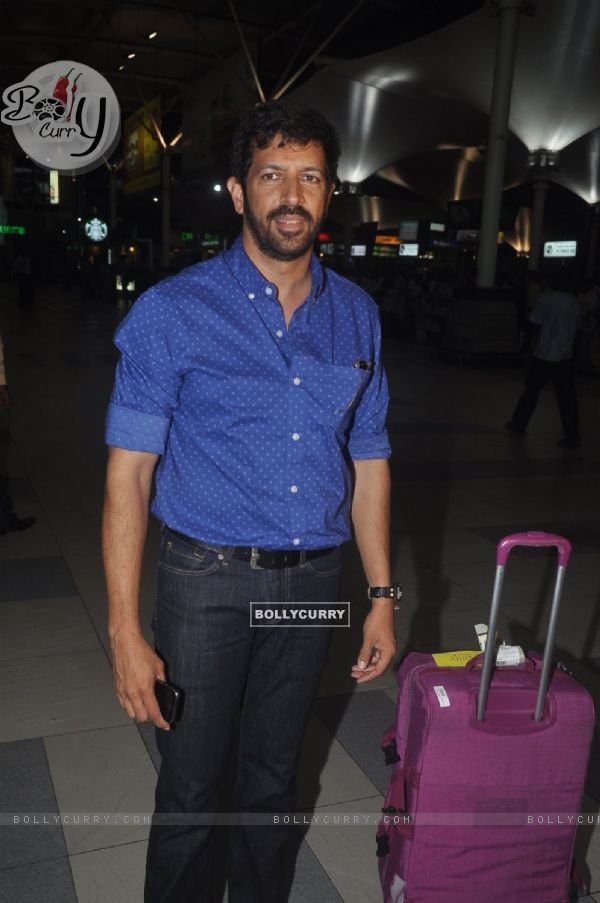 Kabir Khan poses for the media at airport while returning from Arpita Khan's Wedding