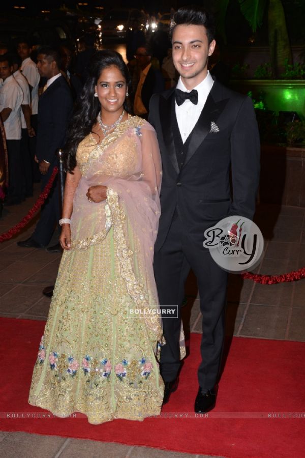 Arpita Khan and Aayush Sharma pose for the media at their Wedding Reception