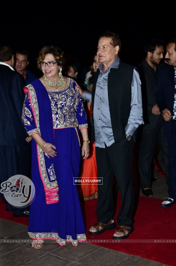 Salim Khan and Helen pose for the media at Arpita Khan's Wedding Reception