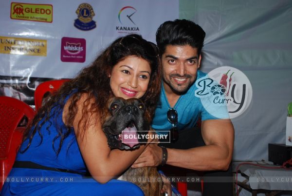 Gurmeet Choudhary and Debina pose with a dog at Pet Adoptathon 2014