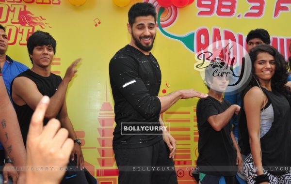 Sidharth Malhotra performs with his fans at the Radio Mirchi event at Equal Street