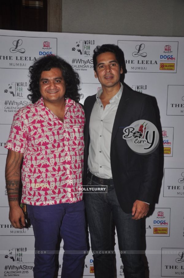 Dino Morea poses with Sahil Mane at 'Why A Stray' Calendar Launch