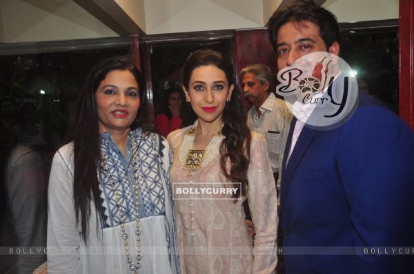 Karisma Kapoor poses with guests at Notandas Jewelers New Collection Launch