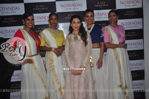 Karisma Kapoor poses with models at Notandas Jewelers New Collection Launch