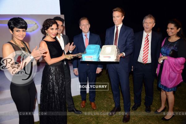 Sophie Choudry cuts the cake at the British Airways Bash