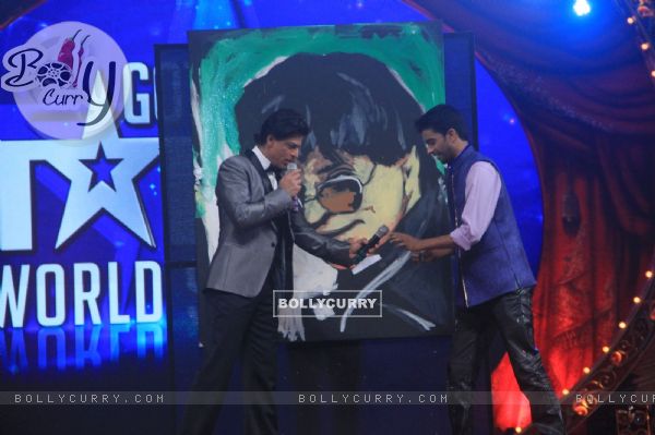 Shah Rukh Khan with a contestant at the Opening of Got Talent - World Stage Live