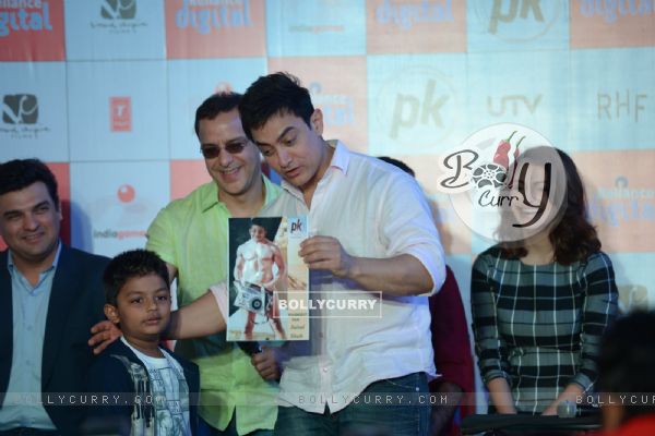 Aamir Khan interacts with a young fan at P.K. Game Launch