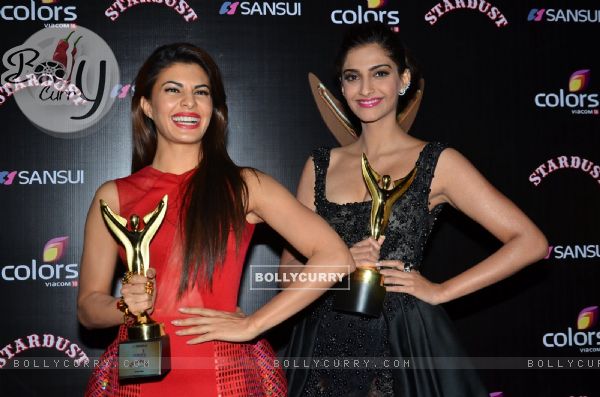 Jacqueline Fernandes and Sonam Kapoor pose with their Awards at Sansui Stardust Awards Red Carpet