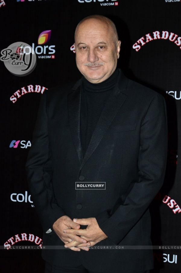 Anupam Kher poses for the media at Sansui Stardust Awards Red Carpet