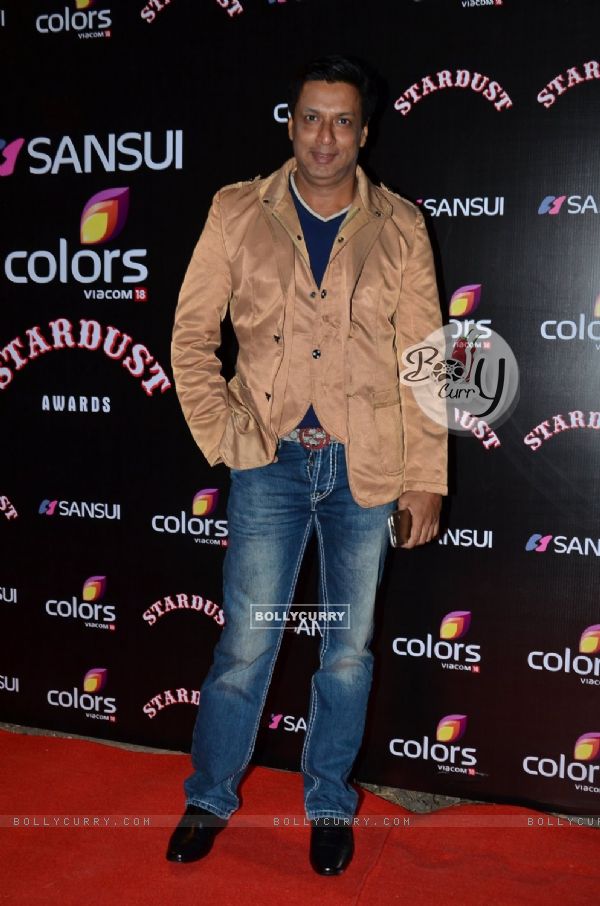 Madhur Bhandarkar poses for the media at Sansui Stardust Awards Red Carpet