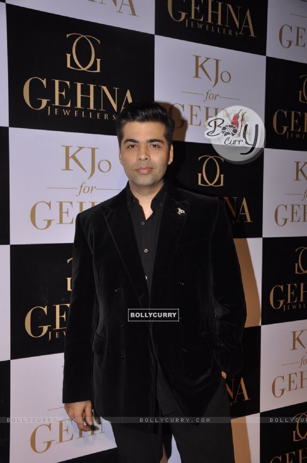 Karan Johar poses for the media at GEHNA Jewelers Collection Launch 'KJO FOR GEHNA'