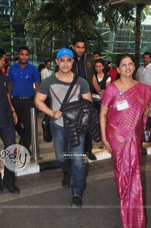 Aamir Khan smiles for the camera at Airport