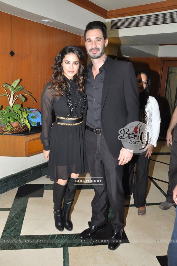 Sunny Leone poses with husband at the Launch of Addiction Deos