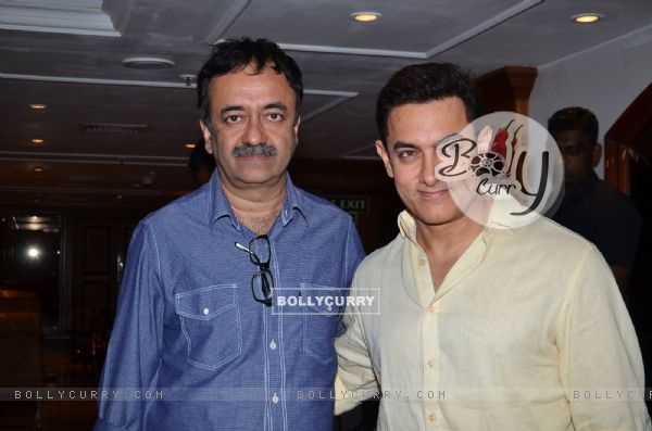 Aamir Khan and Rajkumar Hirani pose for the media at P.K. Contest Winners Meet (349794)