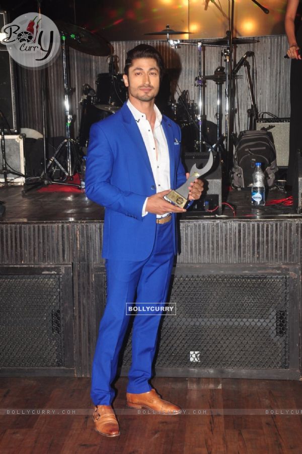 Vidyut Jamwal poses with his award at FHM Bachelor of the Year Bash