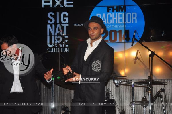 Ranveer Singh poses with his award at FHM Bachelor of the Year Bash
