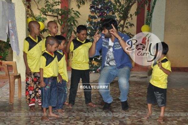 Ali Fazal shakes a leg with Ngo Kids during the Christmas Celebrations
