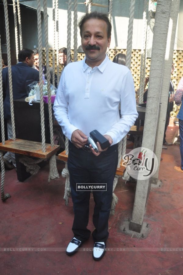 Baba Siddique poses for the media at Joe Rajan's Christmas Bash