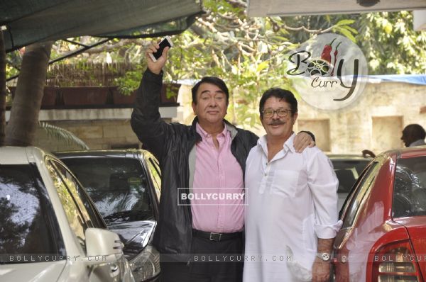 Randhir Kapoor poses with a family member at the Get-to-Gather for a Christmas Lunch