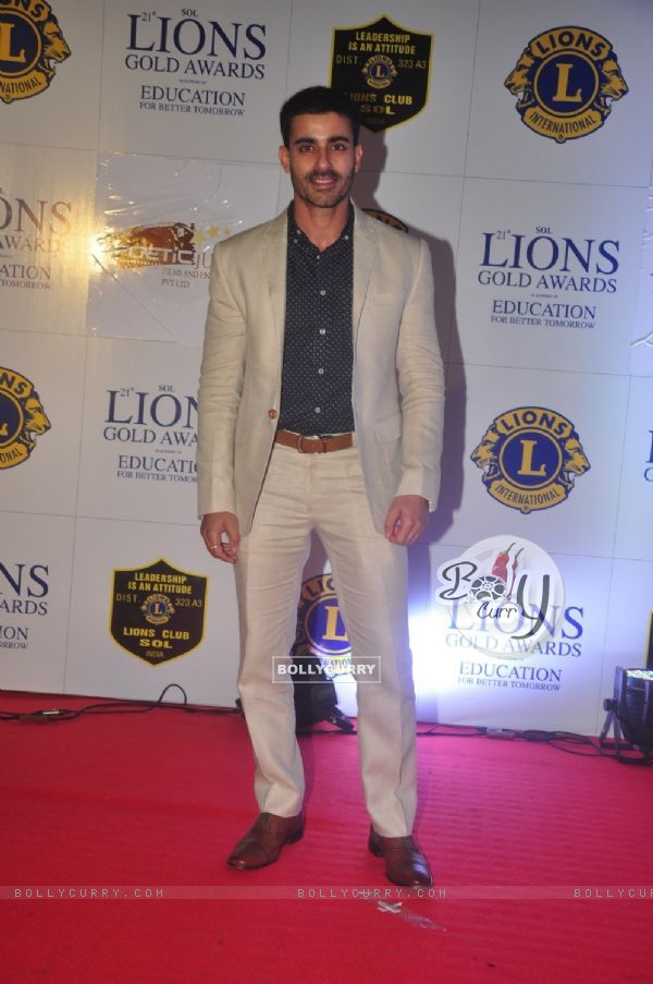 Gautam Rode poses for the media at Lion Gold Awards