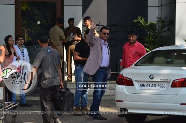 Boman Irani waves out to the cameras at the Airport