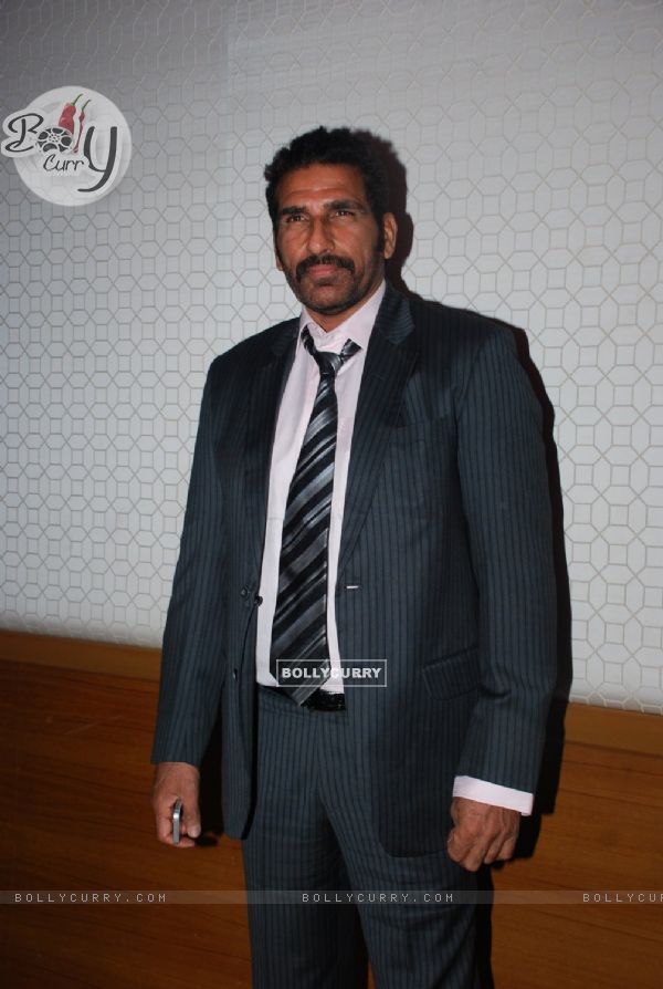 Mukesh Rishi poses for the media at Golden Achiever Awards