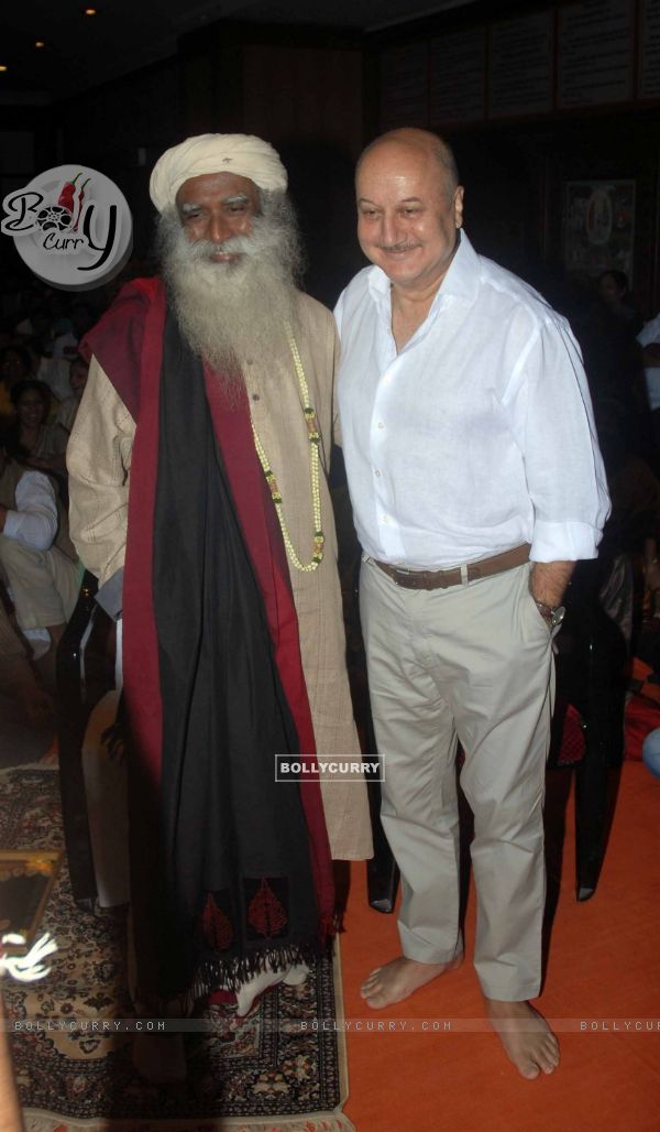 Anupam Kher poses with Sadhguru at the release of the DVD 'Acting to Awakening'