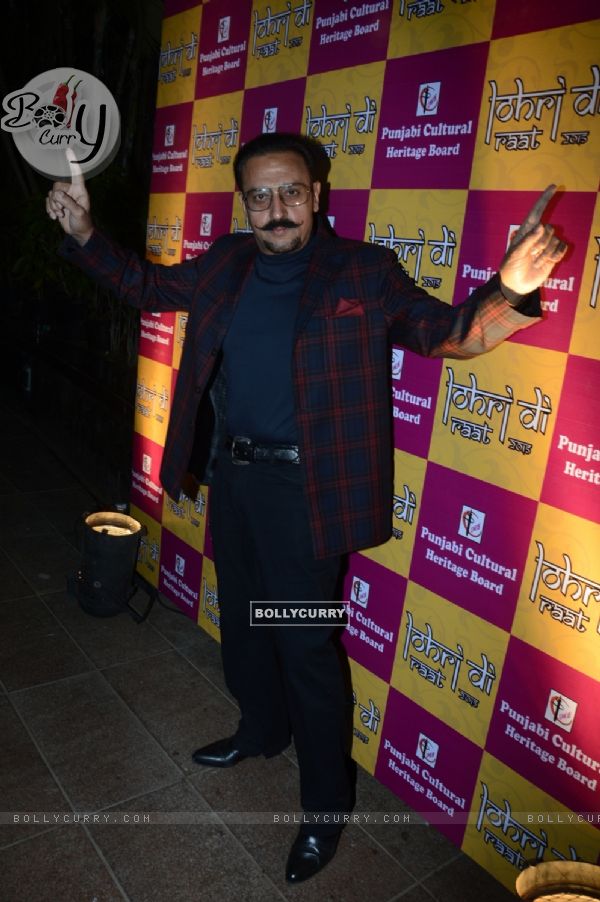 Gulshan Grover poses for the media at Charan Singh's Lohri Celebration