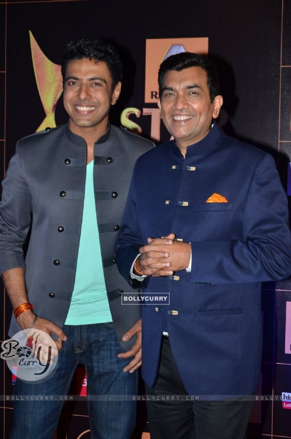 Ranveer Brar and Sanjeev Kapoor pose for the media at Star Guild Awards