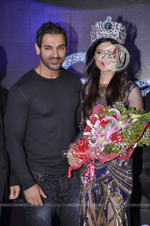 John Abraham poses with the winner at the Launch of Yamaha Fascino Calendar