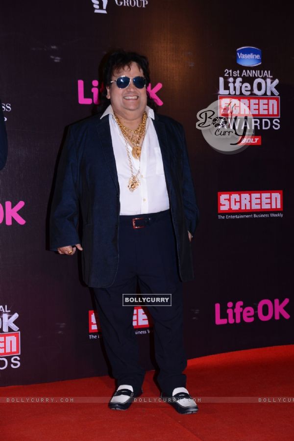 Bappi Lahiri poses for the media at 21st Annual Life OK Screen Awards Red Carpet