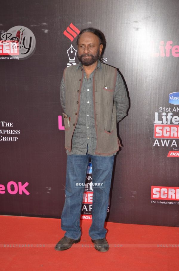 Ketan Mehta poses for the media at 21st Annual Life OK Screen Awards Red Carpet