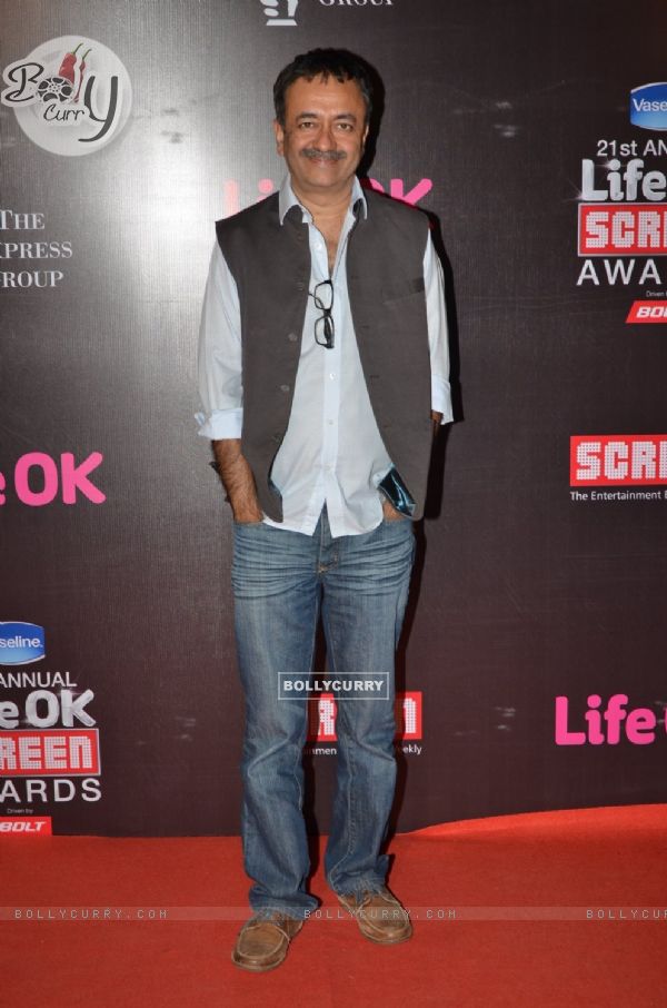 Rajkumar Hirani poses for the media at 21st Annual Life OK Screen Awards Red Carpet