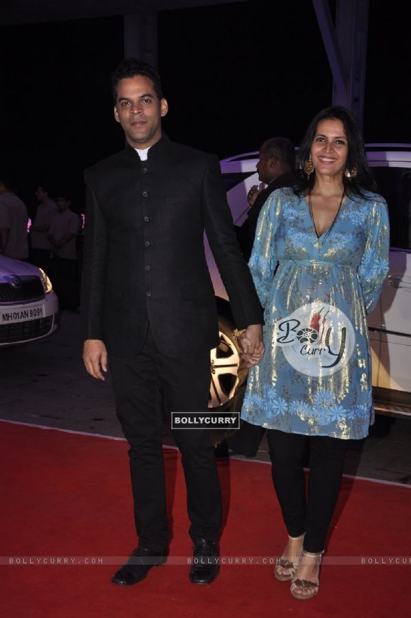 Vikramaditya Motwane poses with wife at Kush Sinha's Wedding Reception
