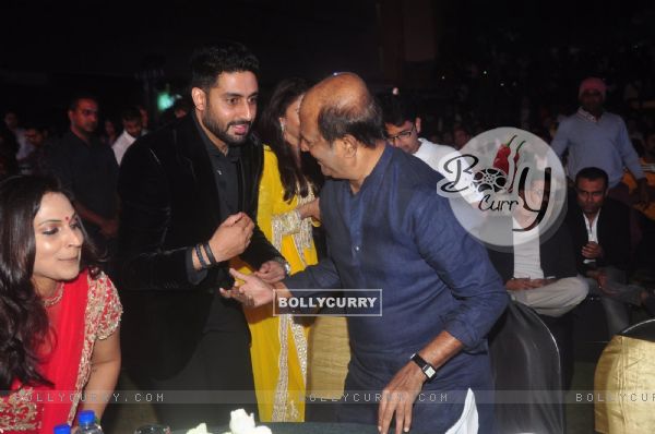 Abhishek Bachchan was snapped greeting Rajinikanth at the Music Launch of Shamitabh