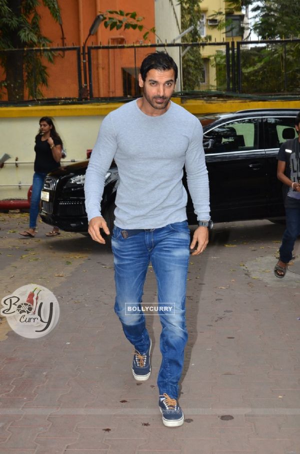 John Abraham poses for the media at the Launch of the Book 'In Search Of Dignity And Justice'