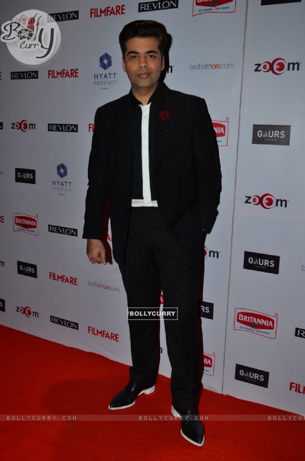 Karan Johar poses for the media at Filmfare Nominations Bash