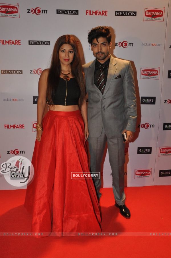 Gurmeet Choudhary and Debina Bonnerjee Choudhary pose for the media at Filmfare Nominations Bash