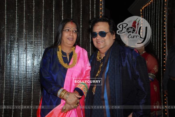 Bappi Lahiri poses with wife at their Wedding Anniversary
