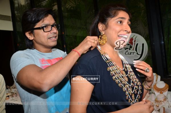 Shaan was snapped putting Jewelry to Wife Radhika Mukherjee at Jyoti Kapoor's Jewellery Exhibition