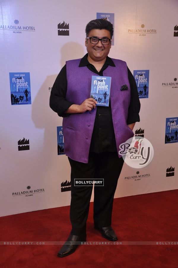 Farhad Samarposes with his Book 'Flash Point' a the Launch